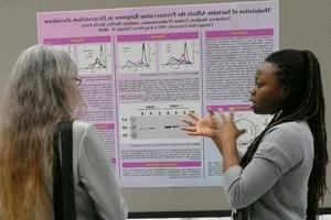 Student presenting her results at conference